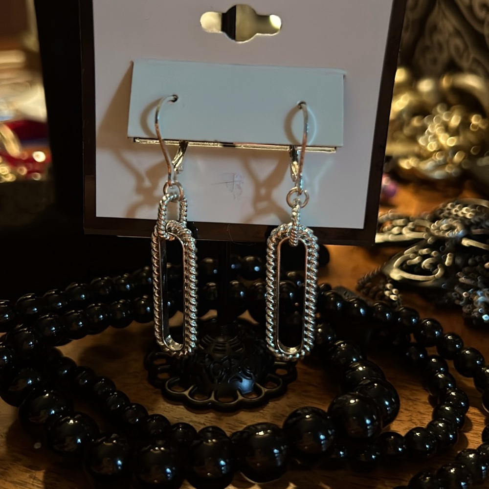 Silver tone dangle earrings